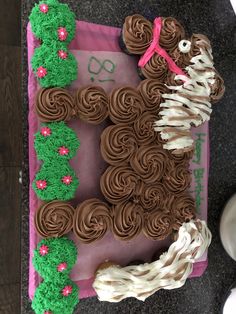 the cake is decorated with chocolate icing and flowers