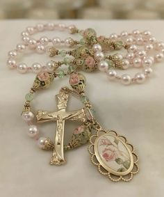 a rosary with an image of jesus on it