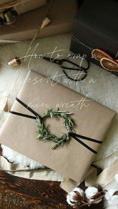 a present wrapped in brown paper and tied with twine, surrounded by other wrapping materials