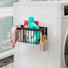 a laundry basket hanging on the side of a washing machine