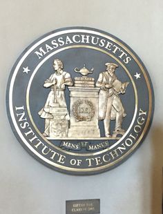 the massachusetts state seal is on display in front of a plaque that reads, institute of technology