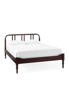 a wooden bed frame with white sheets and pillows on it's headboard, in front of a white background