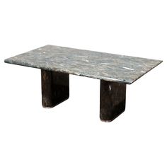 a marble table with two black legs