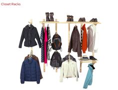 several coats and jackets are hanging on a rack