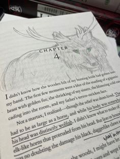 an open book with a drawing of a deer on it's page and the title