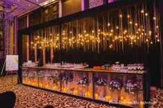 the bar is decorated with candles and flowers