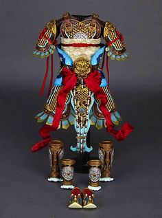 an elaborately decorated statue with red and blue accents