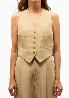 Smythe's Cropped Vest has a fabrication that is seasonless and can be worn alone or as a layer. Moderately tailored, this new single-breasted waistcoat is bra-friendly and cropped to meet the waistband of its coordinating pant. Wear with its coordinating blazer and pant for a directional suit.Consider a vest in place of a tank or tee this season. 52% Rayon, 48% Linen | Lining: 100% Cupro Rayon that is ecotoxicity-free and entirely biodegradable Dry Clean Only Made in Canada Model is 5’8” and wea Cropped Vest, To Meet, Single Breasted, Dry Clean, Size 4, Blazer, Pants, Fabric, How To Wear