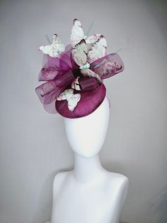 From the 2024 Featured Milliner of the Kentucky Derby Museum  Gorgeous Kentucky Derby hat fascinator  kentucky derby hat fascinator purple violet sinamay with matching crinoline light pink lavender mint floral green  butterflies  headband attachment each hat is totally one of a kind! no two are alike! I can probably add feathers, flowers etc to existing hats for a small fee. I cannot remove anything from existing hats. Just message me and see if we can make it work! :) I cannot make custom order Purple Headpieces For Spring Races, Whimsical Purple Fascinator For Parties, Purple Fascinator For Kentucky Derby Garden Party, Purple Fascinator For Royal Ascot, Purple Fascinator For Royal Ascot Races, Purple Fascinator For Royal Ascot Garden Party, Purple Mini Hats For Spring Races, Purple Mini Hats For Summer Garden Party, Purple Kentucky Derby Fascinator For Races