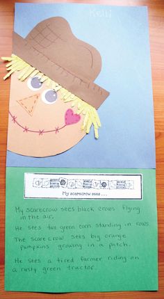 a child's handmade paper card with a scarecrow on it