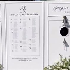 there is a large white sign with flowers in front of it and the words king sir and be seated on it