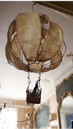 a basket hanging from the ceiling in a room