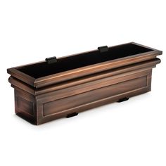 a large wooden box with black lid