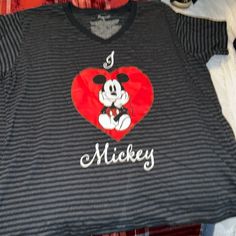 Never Worn Brand New Black Disney Fan Merchandise T-shirt, Fun Black Mickey Mouse T-shirt, Black Disney T-shirt For Fan Events, Black Mickey Mouse Tops For Disney Events, Black Mickey Mouse Top For Disney Fan Events, Black Disney Graphic Tee, Black Graphic Print Tops For Disney Fan Events, Black Disney Cotton Top, Black Disney Graphic Print Tops