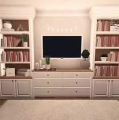 a living room with bookshelves and a tv on top of the entertainment center