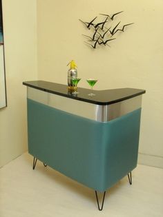 a blue and chrome bar in the corner of a room