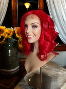 "This wig is absolute heaven! For all those out there with a zest for life, loving that bold color and curls with a flattering shape.  She has perfect layering and her curls are beautiful. Her color is a bright cherry red for an eye catching effect! She fits heads up to 22\" with her hand tied, machine made design and lots of baby hairs. Deep hand tied center parting.  Wear her brushed out for volume or smooth her down for a daytime look. Tuck her behind your ears or wear the sides forward. 16\" Bright Red Wig, Medium Length Wig, Alopecia Wig, Chemo Wig, Red Wig, Baby Hairs, Red Wigs, Pixie Cut Wig, Rocker Chic