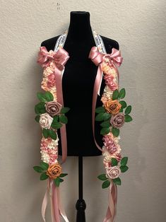 a mannequin with flowers and ribbons around it