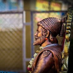 a statue of a man with a long beard