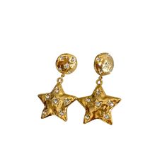 The Marbella Star Drop Earrings The Marbella Star Drop CZ earrings are our new personal favorite. This trendy and stylish piece is accompanied with star shaped CZ stones and a gold crush texture to make these earrings your go to this summer.  Product Description Made of stainless steel and 18k gold pvd plating  100% ec Star Drop Earrings, Dope Jewelry, Funky Jewelry, Jewelry Lookbook, Demi Fine Jewelry, Star Jewelry, Cz Earrings, Girly Jewelry, Jewelry Inspo