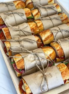 sandwiches wrapped in brown paper and tied with twine