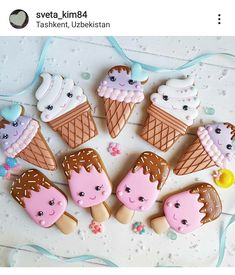 decorated cookies are arranged in the shape of ice cream cones