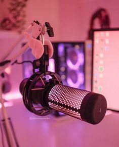 a microphone sitting on top of a table next to a computer