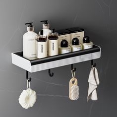 a shelf with soaps, lotions and other personal care items hanging from it