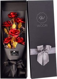 red roses in a black box with silver ribbon around the bow and name woori on it