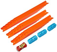 four orange and blue plastic parts for a toy train set on a white background with clippings