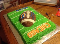 a football themed cake on top of a table