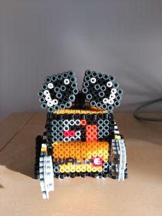 a car made out of legos sitting on top of a table