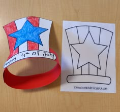 a paper crown with a ribbon around it on a table next to a card that says happy 4th of july