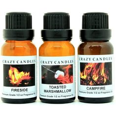 three bottles of crazy candles toasted marshmallow and campfire essential oil on a white background