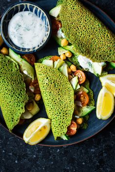 a plate topped with fish covered in avocado