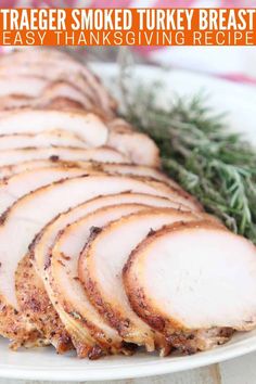 sliced turkey breast on a white plate with rosemary garnish and text overlay