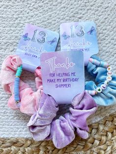 some hair accessories are laying out on a woven mat with the words thank for helping me make my birthday shimpie