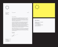 a letterhead and business card with a clock on the wall next to each other