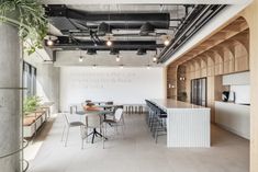 an open kitchen and dining area in a building