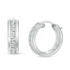 From the Diamond Fascination™ Collection, these hoop earrings bring the bling. Fashioned in 14K white gold over a resin core, each 5.0mm x 20.0mm hoop features diamond enamel pavé along the front-facing edge. Diamond Fascination™ jewelry shimmers with a diamond accent and a pavé of diamond dust crystallized into enamel - a patented handmade process that results in a high-end look. Buffed to a brilliant luster, these earrings secure with latch backs. Everyday Silver Jewelry With Channel Set, Classic Diamond Jewelry With Shiny Finish, Modern Small Hoop Jewelry With Prong Setting, White Sterling Silver Hoop Earrings With Diamond Accents, Everyday White Gold Channel Set Jewelry, Fine Jewelry Channel Set Hoop Earrings, Diamond White Classic Hoop Earrings, Classic Silver Channel Set Huggie Earrings, Small Hoop Sterling Silver Earrings In Diamond White