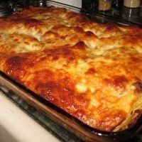 a casserole is sitting in the oven ready to be cooked and baked for dinner