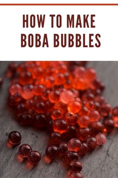 the words how to make boba bubbles are in front of some red beads