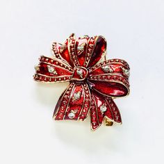 Red rhinestone Christmas bow holiday brooch! Not intended for children ages 13 and under. Also, for many items we can accommodate large orders, so please send us a message. Red Brooch For Valentine's Day Party, Holiday Rhinestone Jewelry For Gifts, Holiday Rhinestone Jewelry Gift, Gold Brooches For Christmas Gift, Holiday Gift Jewelry With Rhinestones, Holiday Jewelry Gift With Rhinestones, Red Christmas Brooch For The Holidays, Red Christmas Brooch For Holidays, Christmas Gift Rhinestone Jewelry