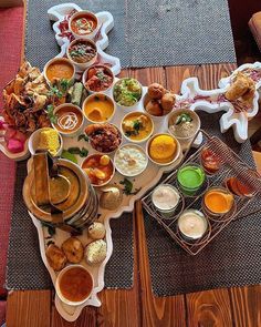 a table topped with lots of different types of food