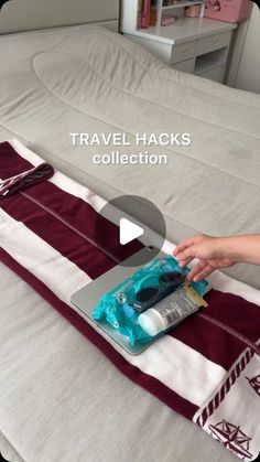 a person is cleaning a bed with travel hacks on the cover and in front of it