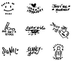 some stickers that have been drawn on the side of a whiteboard with black ink