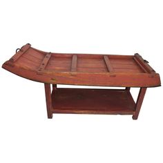 an old wooden boat shaped coffee table