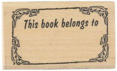 a rubber stamp with the words, this book belongs to