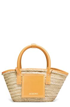 Smooth calfskin leather trim and gilt logo lettering polish this scaled-down basket bag handwoven in Spain from palm leaves. Top handles and a crossbody strap offer carrying options. Bridge-clip closure Top carry handles; crossbody strap Unlined Palm with leather trim Made in Spain Designer Handbags Palm Baskets, Dark Yellow, Basket Bag, Palm Leaves, Crossbody Strap, Leather Trim, Leather Trims, Designer Handbags, Calf Skin