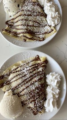 two plates topped with different types of desserts and ice cream on top of them